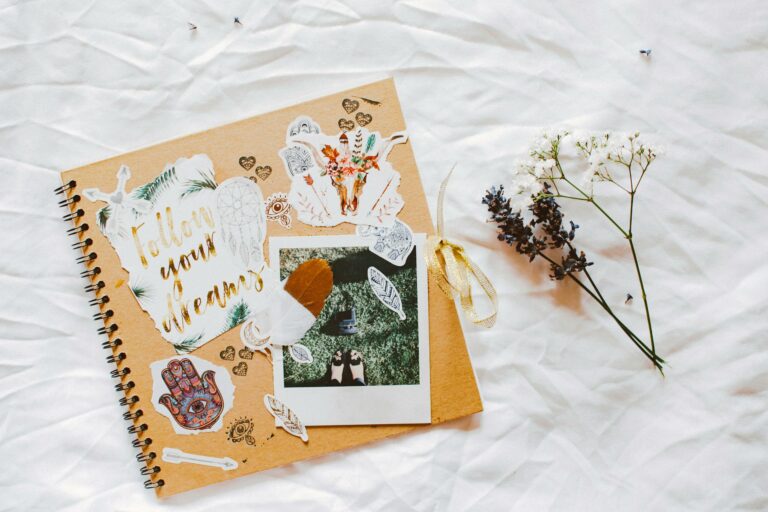 A dreamy scrapbook layout with floral decorations and motivational cutouts.